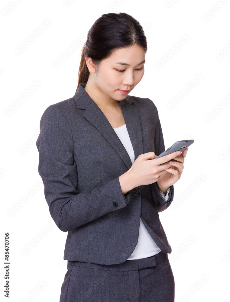Asian businesswoman use of cellphone Asian businesswoman use of cellphone