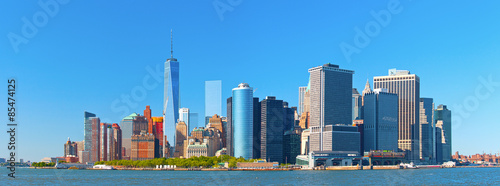 New York City lower Manhattan financial  wall street district buildings skyline on a beautiful summer day with blue sky © FotoMak
