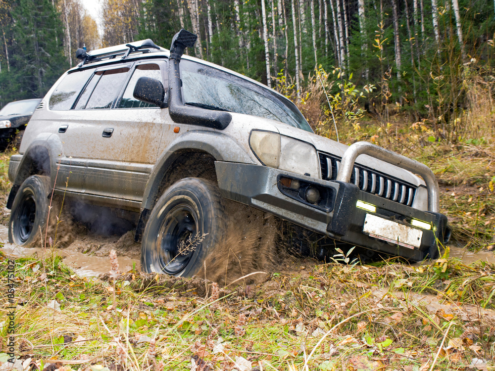 Autumn thaw. Jeep got stuck in the woods Autumn thaw. Jeep got stuck in the woods