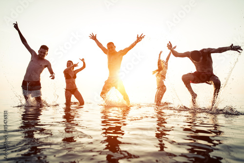 group of friends having fun in the water