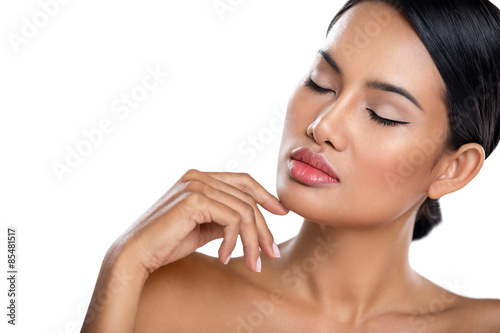 young woman touching her perfect skin