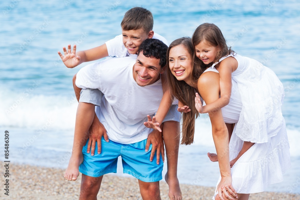 Adults, back, beach. Adults, back, beach.