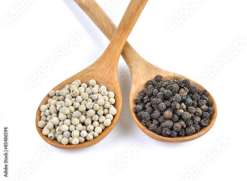 peppercorn in the wooden spoon on white background