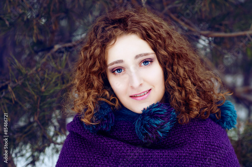 Mysterious young woman in purple cape with a hood © different_nata