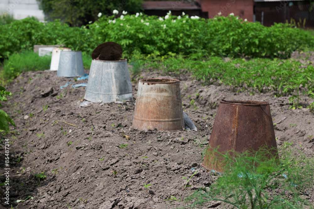 Old buckets on a bed