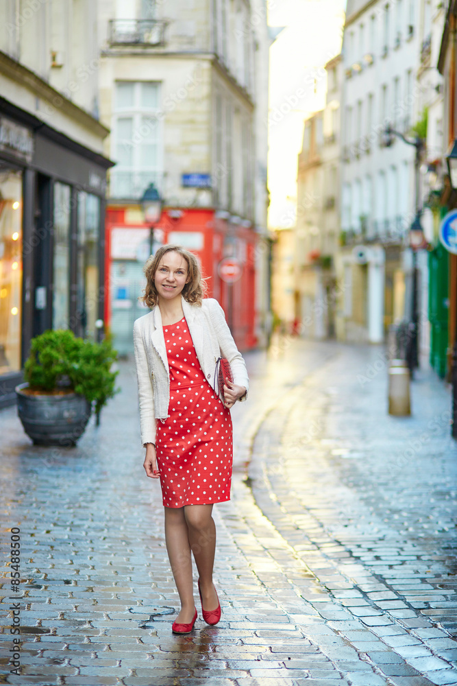 Beautiful young woman walking in Paris