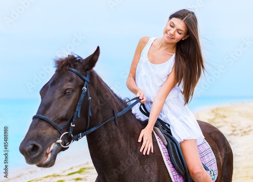 Beach, woman, horseback.