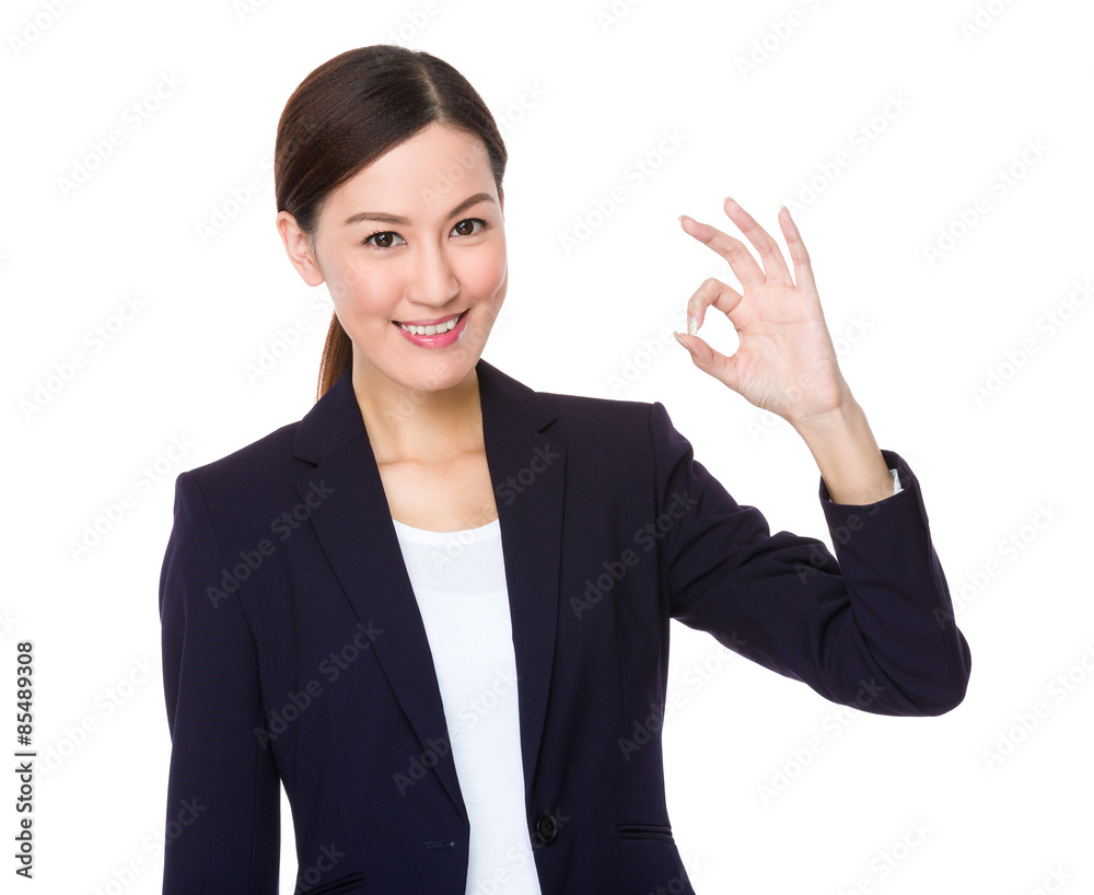 Asian businesswoman with ok sign gesture Asian businesswoman with ok sign gesture