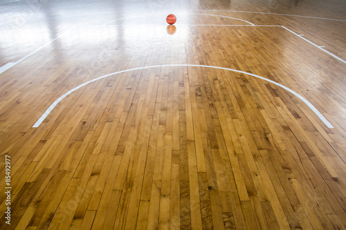 Basketball ball over floor in the gym