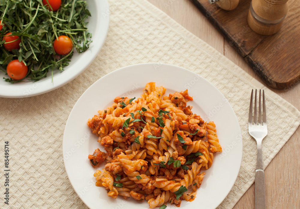 pasta bolognese tomato beef sauce on the kitchen table pasta bolognese tomato beef sauce on the kitchen table