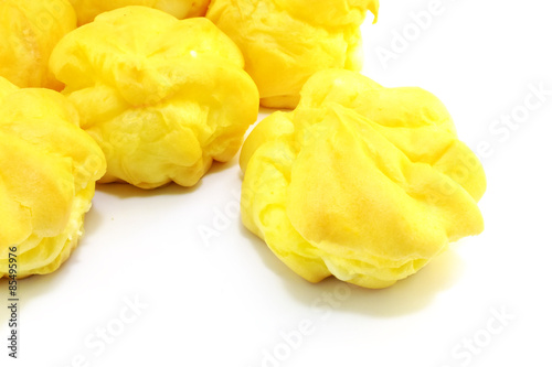 close up of cream puffs isolated on white background