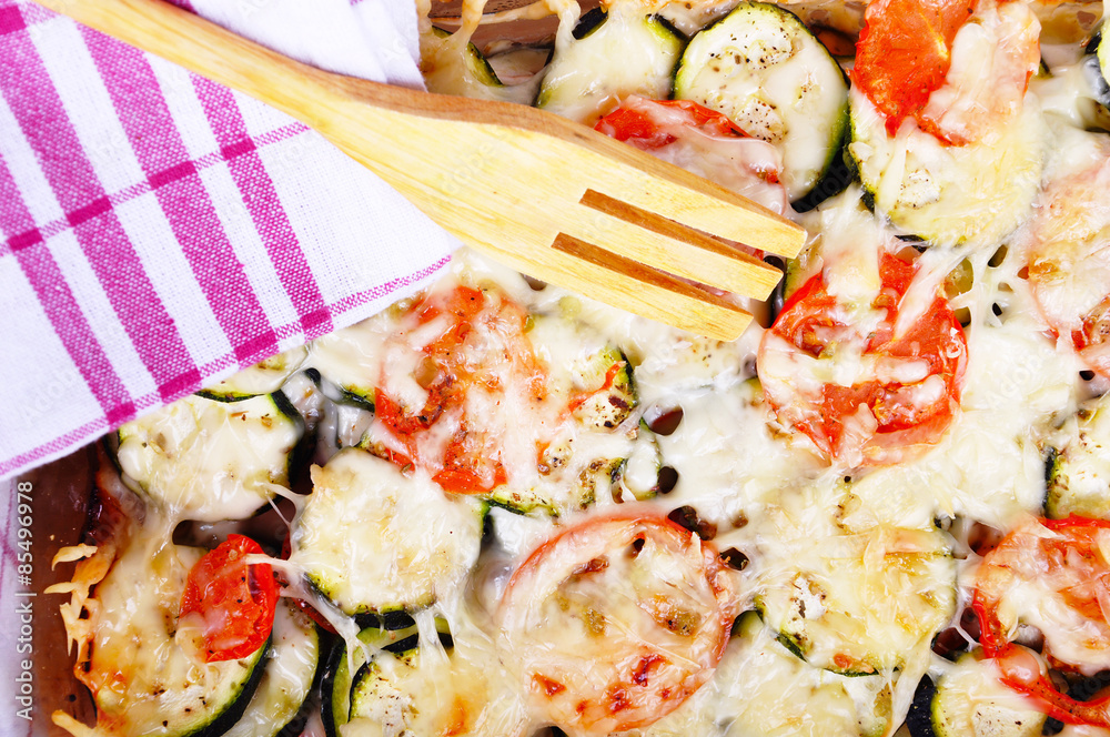 Tomatoes and zucchini baked with cheese Tomatoes and zucchini baked with cheese