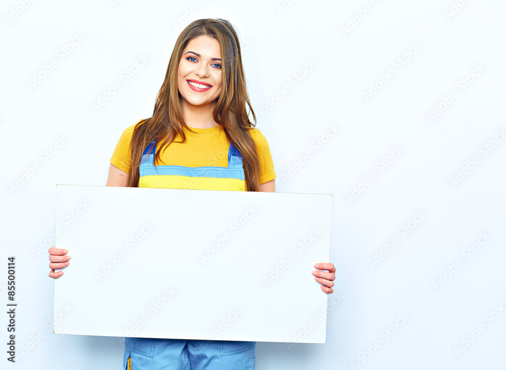 Young woman hold sign board. Portrait of smiling builder woman Young woman hold sign board. Portrait of smiling builder woman