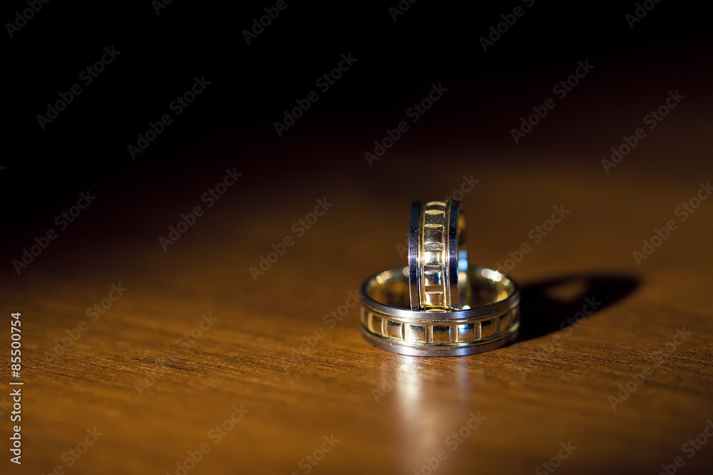 Wedding rings on a dark background, selective focus Wedding rings on a dark background, selective focus