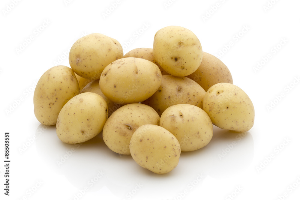 Potatoes on the white background. New harvest. Potatoes on the white background. New harvest.