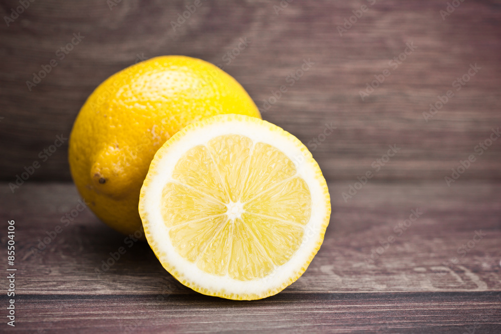 Lemon cut on wooden table. Lemon cut on wooden table.