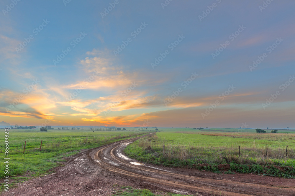 Sunset and a muddy road