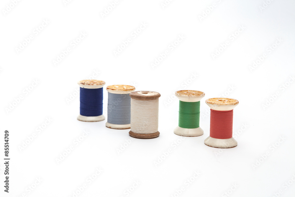 spool of thread on white background spool of thread on white background