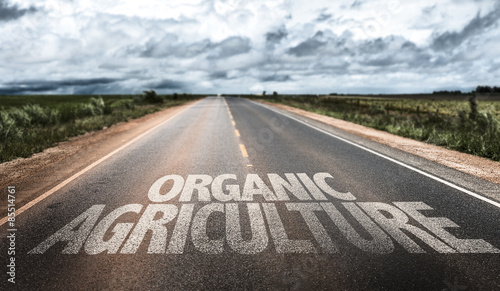 Organic Agriculture written on rural road