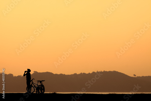 Cyclist rides at sunset. © pojvistaimage