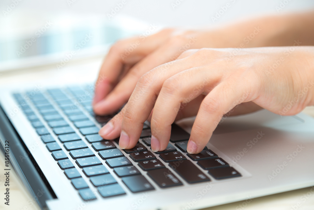 Closeup of business woman hand typing on laptop keyboard Closeup of business woman hand typing on laptop keyboard