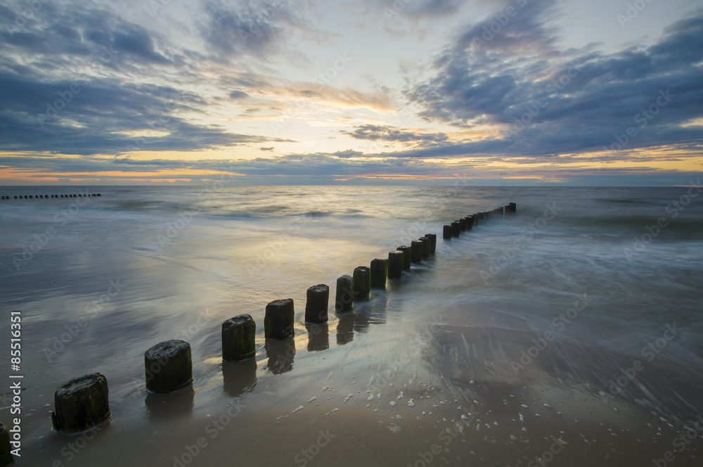 Fototapeta premium sunset over the sea beach