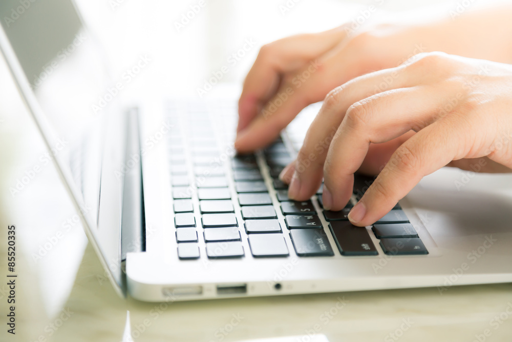 Closeup of business woman hand typing on laptop keyboard ( Filte Closeup of business woman hand typing on laptop keyboard ( Filte