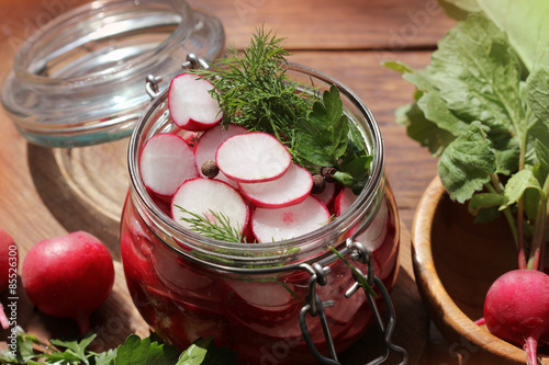 Foto Glass Jar with Pickled Radishes