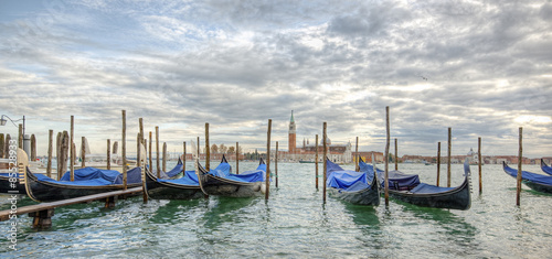 Gondolas in lagoon of Venice and San Giorgio island in background, Italy © AR Pictures