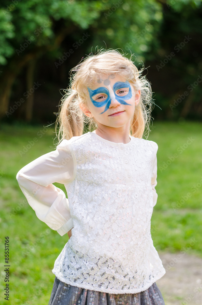 blond girl with facepainting