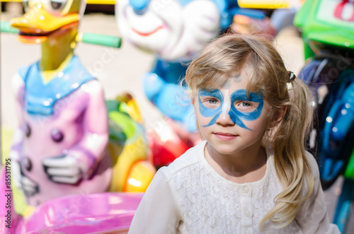 blond girl with facepainting photo