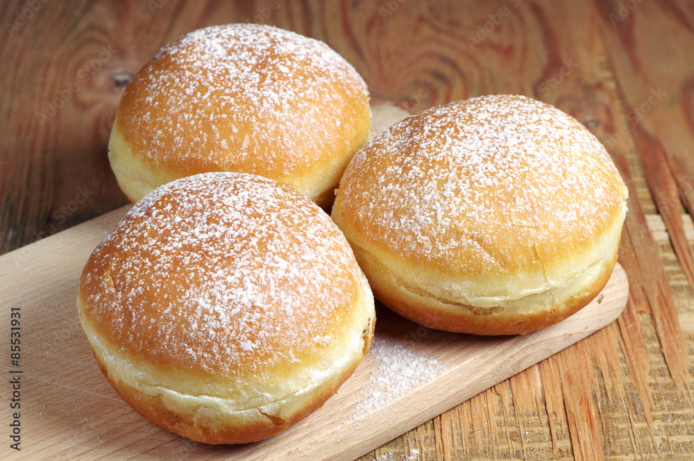 Sweet donuts on table