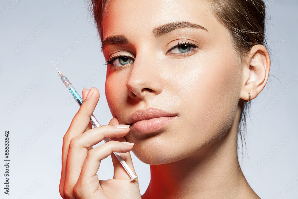 close-up of a woman with a syringe from the person close-up of a woman with a syringe from the person