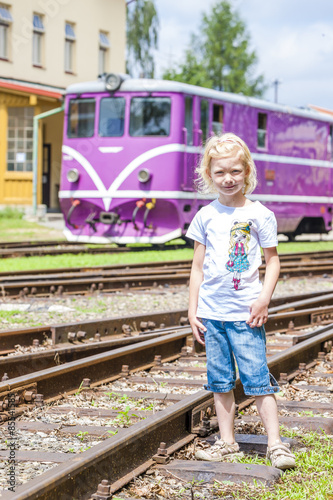 little girl at railway station of Nova Bystrice, Czech Republic photo