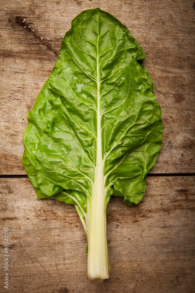 Fototapeta premium Cos lettuce on wooden background