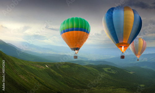 Colorful balloons flying in the mountain 