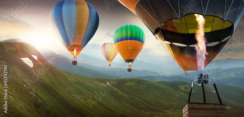 Fotografie, Tablou Colorful balloons flying in the mountain