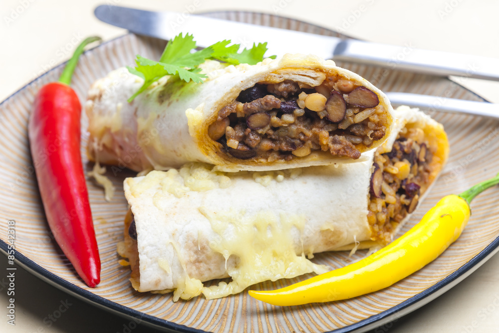 burrito filled with beef minced meat and beans baked with gouda burrito filled with beef minced meat and beans baked with gouda