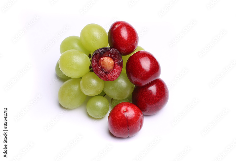 cherry, bunch of grapes on white background