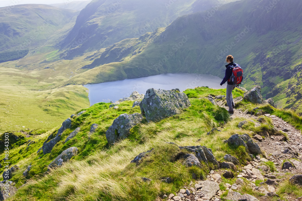 Fototapeta premium A lone hiker walking in the Lake District