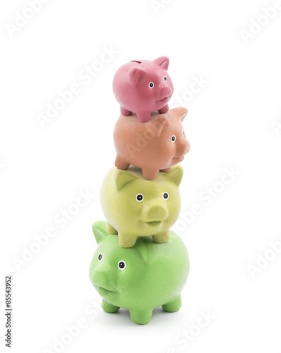 Stack of colorful piggy banks. Energy saving concept. 