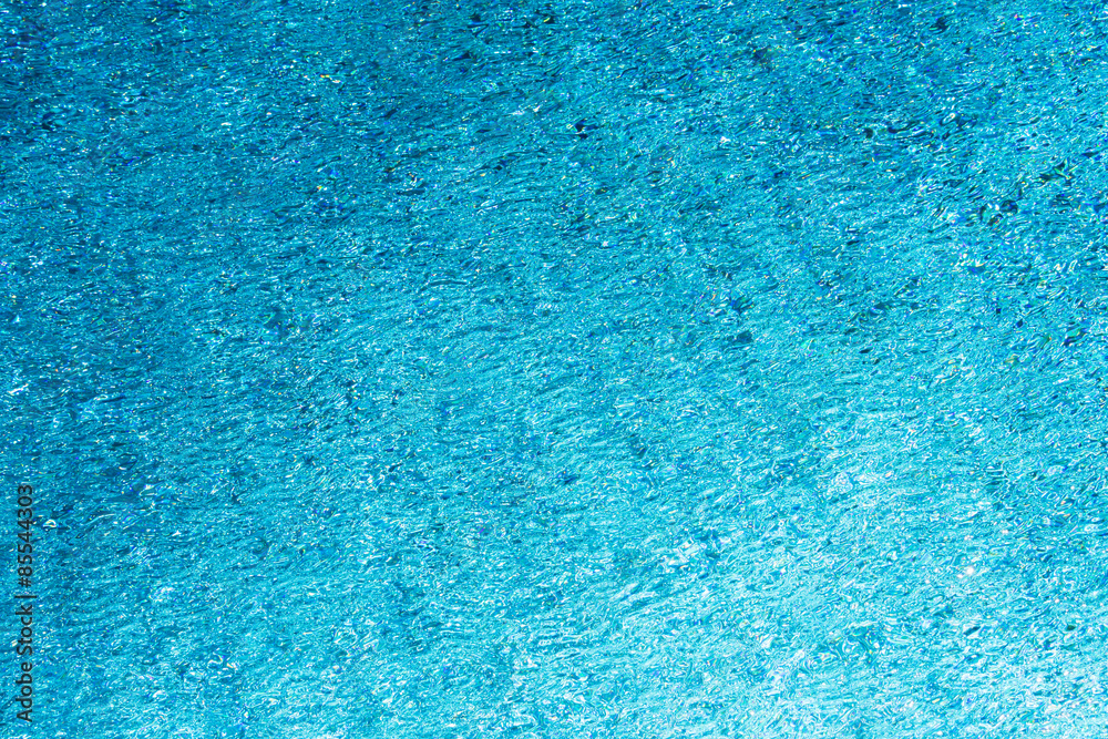 Texture of a blue clear swimming pool water. Texture of a blue clear swimming pool water.