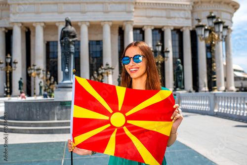 Canvas Print Woman with macedonian flag in Skopje city center