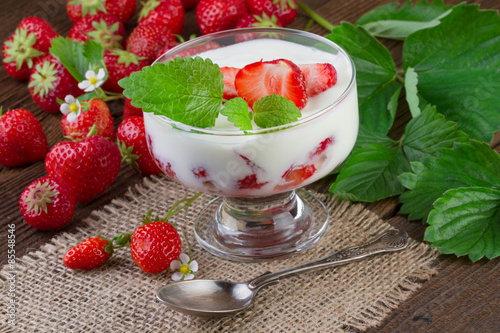 Strawberry Dessert in a Glass on jute background