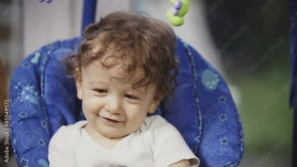 Cute Toddler on a Swing. Shoot on Digital Cinema Camera - ProRes 422 codec.