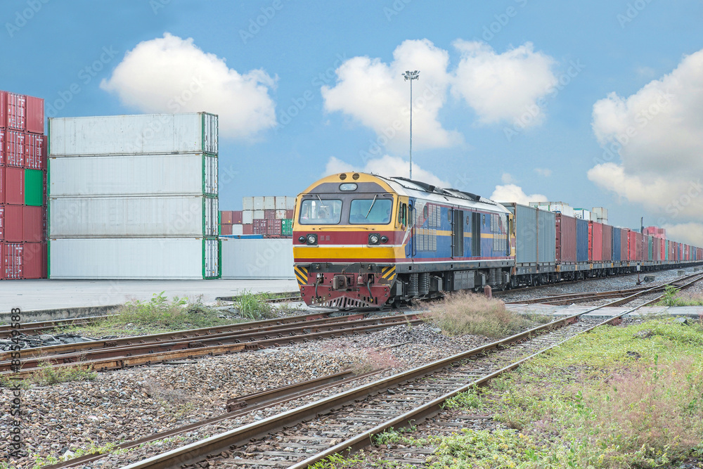 Cargo train platform with freight train container at depot Cargo train platform with freight train container at depot