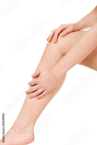Woman massaging her leg.