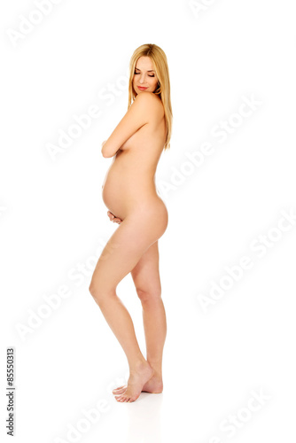 Pregnant woman covering her breast