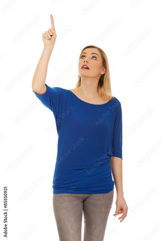 Beautiful woman pointing down. Beautiful woman pointing down.