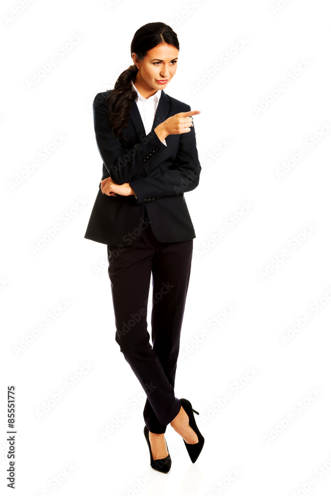 Business woman showing copy space on the right Business woman showing copy space on the right
